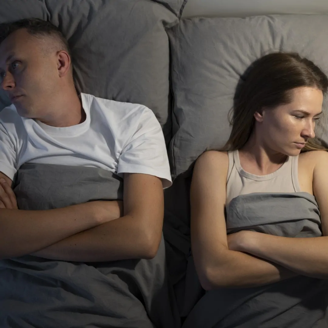 close-up-couple-sleeping-angry-with-each-other